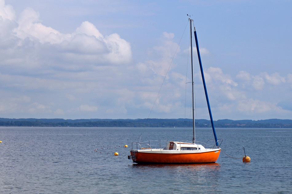 sailing ship against a bright blue sky