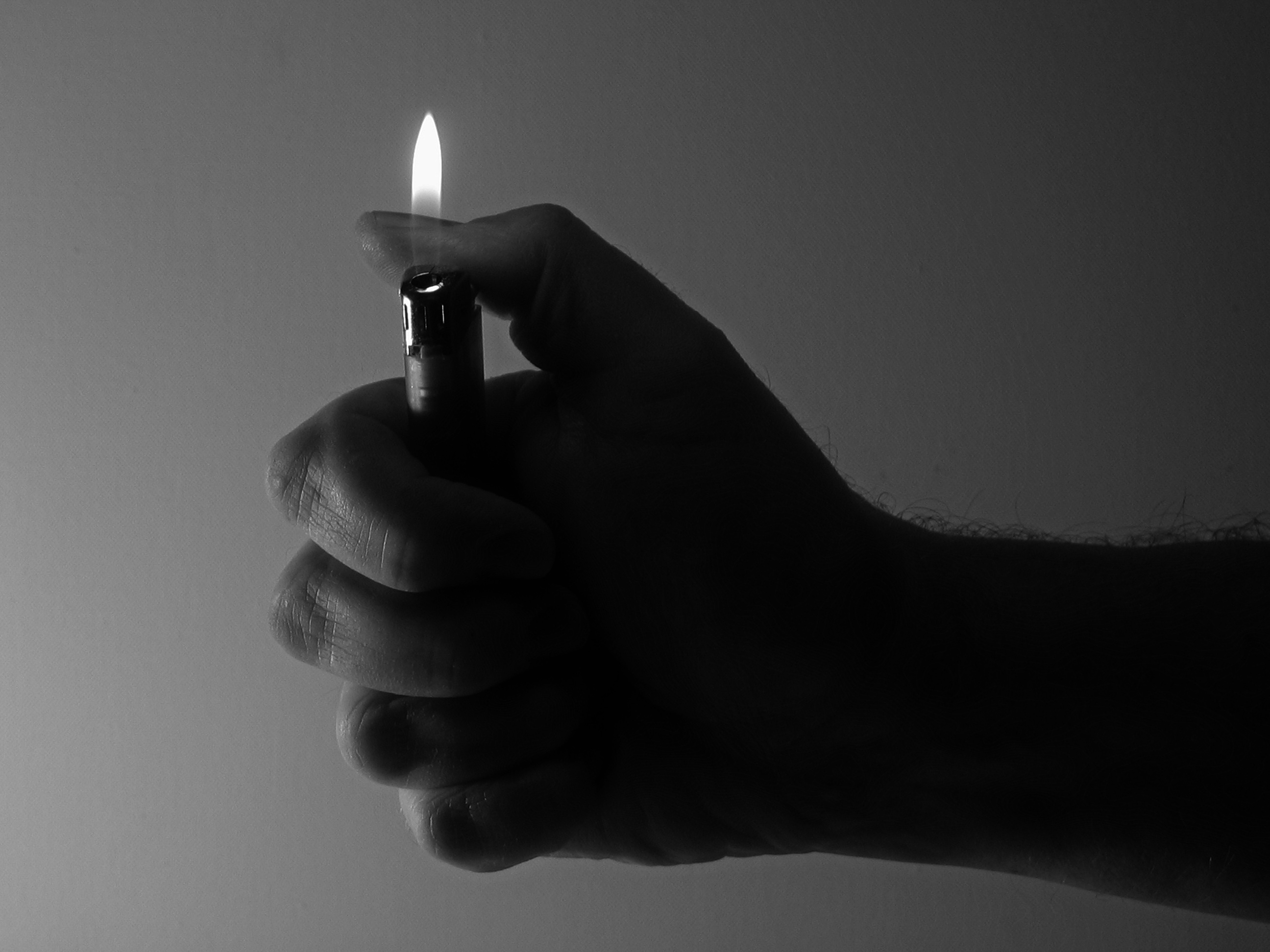 lighter-flame-in-hand-free-image-download