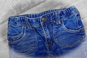 top of blue Jeans Pants at grey background