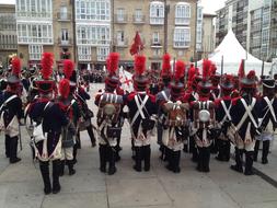 people in costumes standing in the square