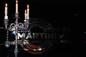 iron sign by candle