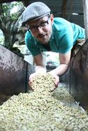 man with grains in his hands