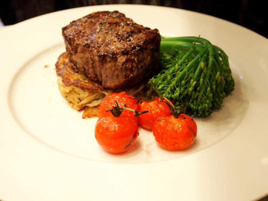 steak, tomatoes, greens for lunch at a cafe in Hong Kong