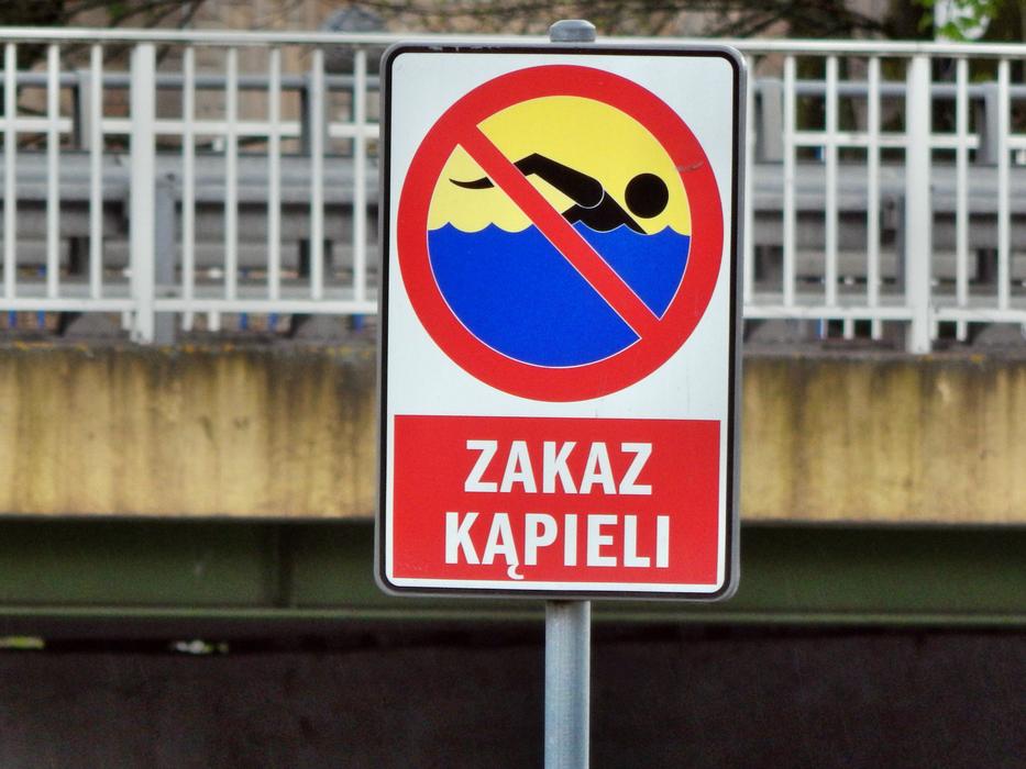 Bathing Prohibition Sign at metal fence