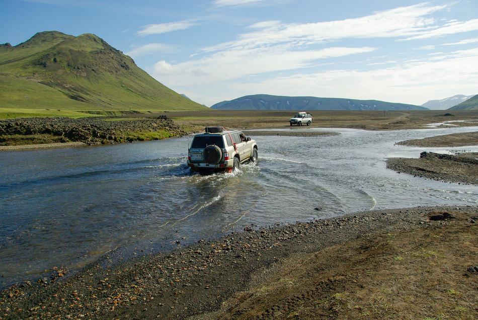 Ford car in River in Iceland
