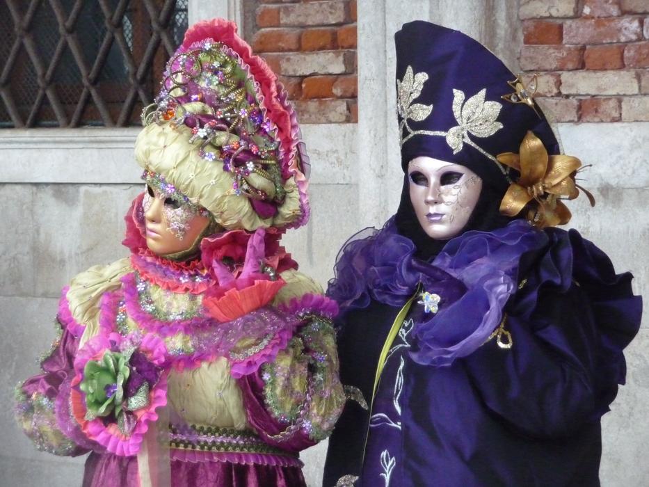 people in carnival costumes at the festival in Venice