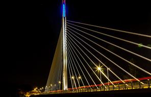 illuminated bridge at night