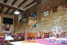 The interior of the restaurant with a brick wall