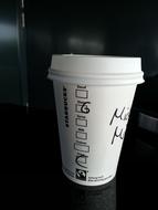 white cardboard cup