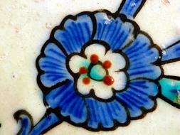 Beautiful mosaic, with the beautiful, blue, white, brown and black flower