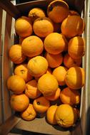 Oranges lying in a box