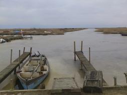 wooden boat standing near the fish pier