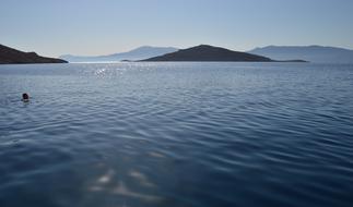 Swimmer alone in Sea in Chalki