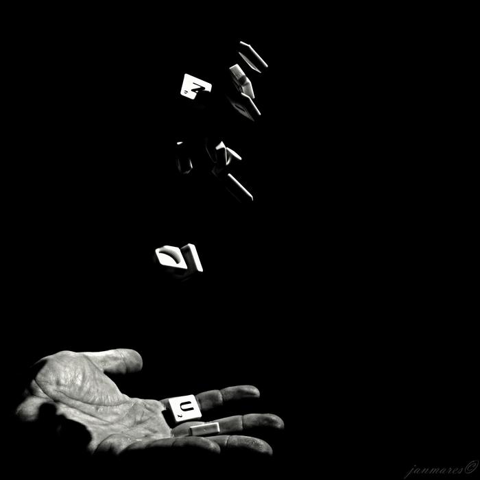 Scrabbles, word game tiles on male hand