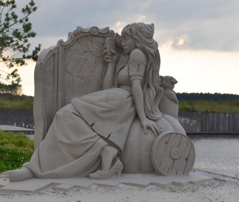 cinderella with smartphone, Sand Sculpture on waterside