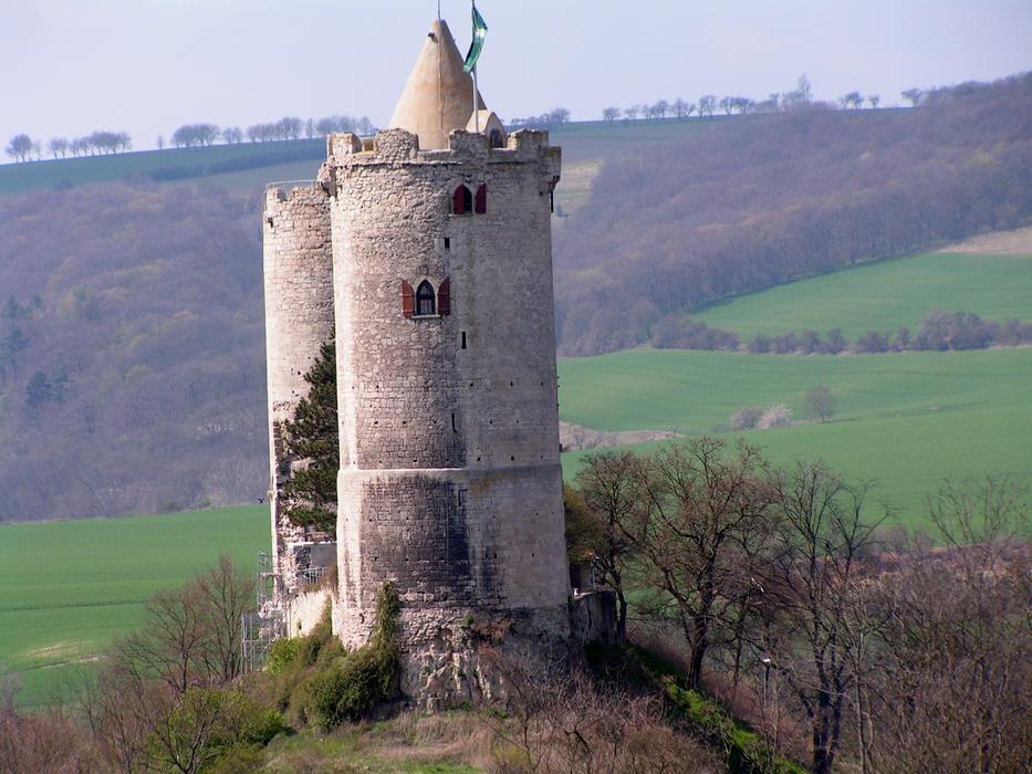 tower on a hill against the backdrop of green fields
