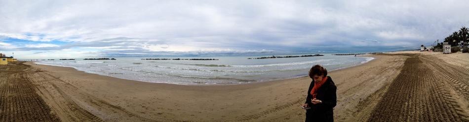 Panoramic photo of a girl by the sea