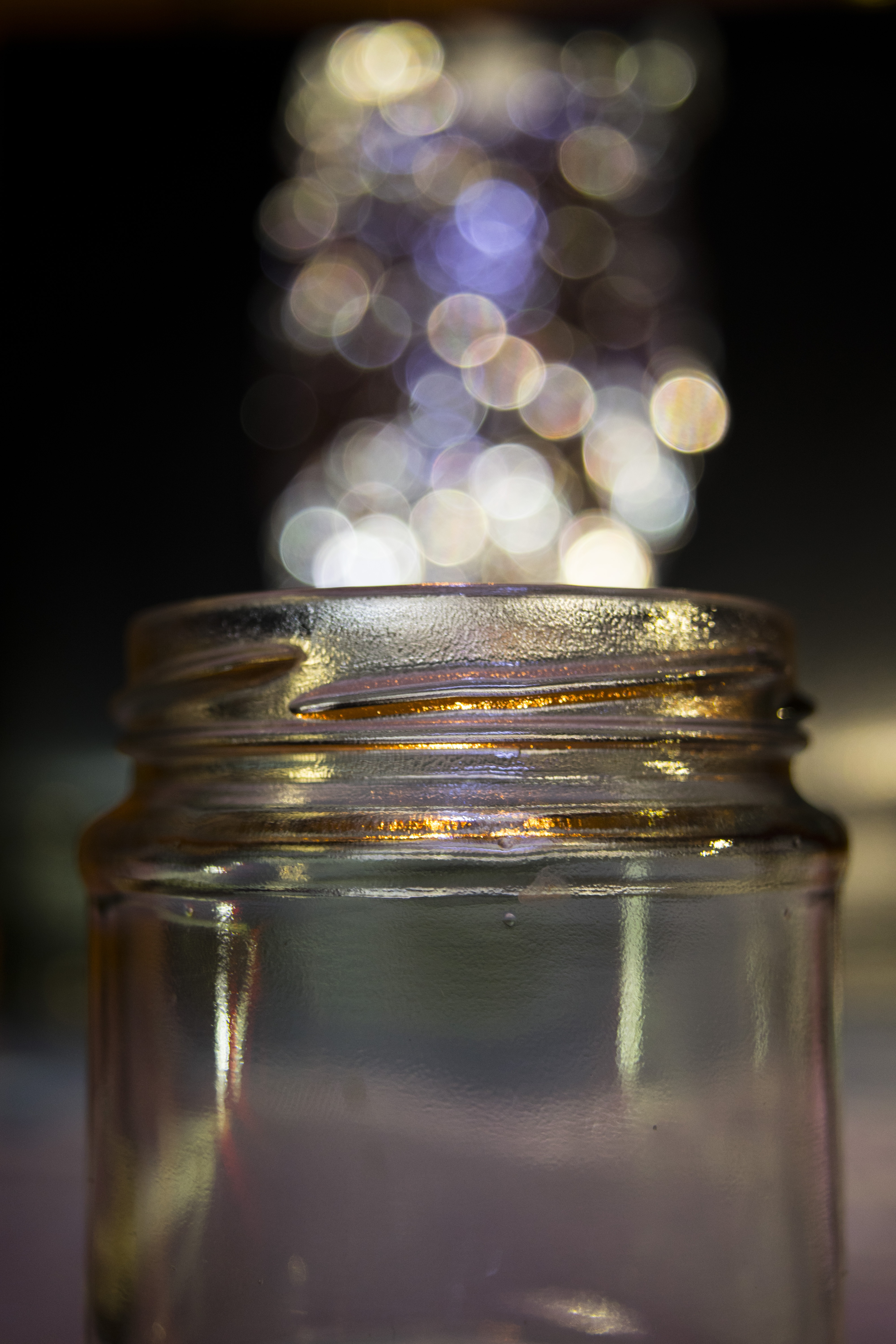 Guy Sits On Glass Jar