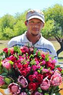 asian man with bunch of Flowers outdoor