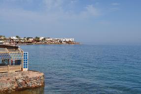 Houses standing on a rock near the sea