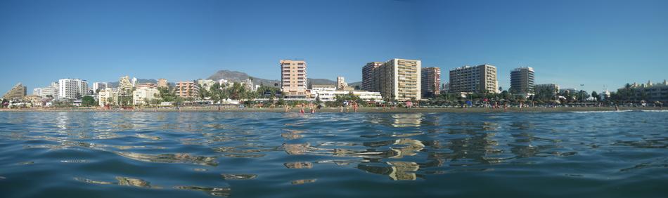 Panoramic photo of the city next to the sea