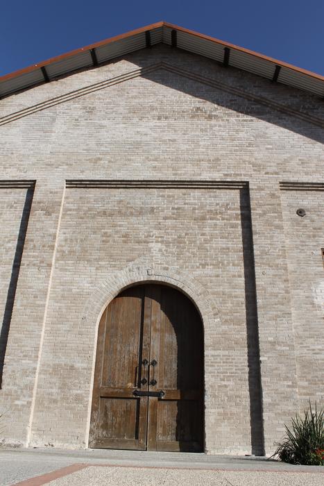 wooden door and stone facade of an old building