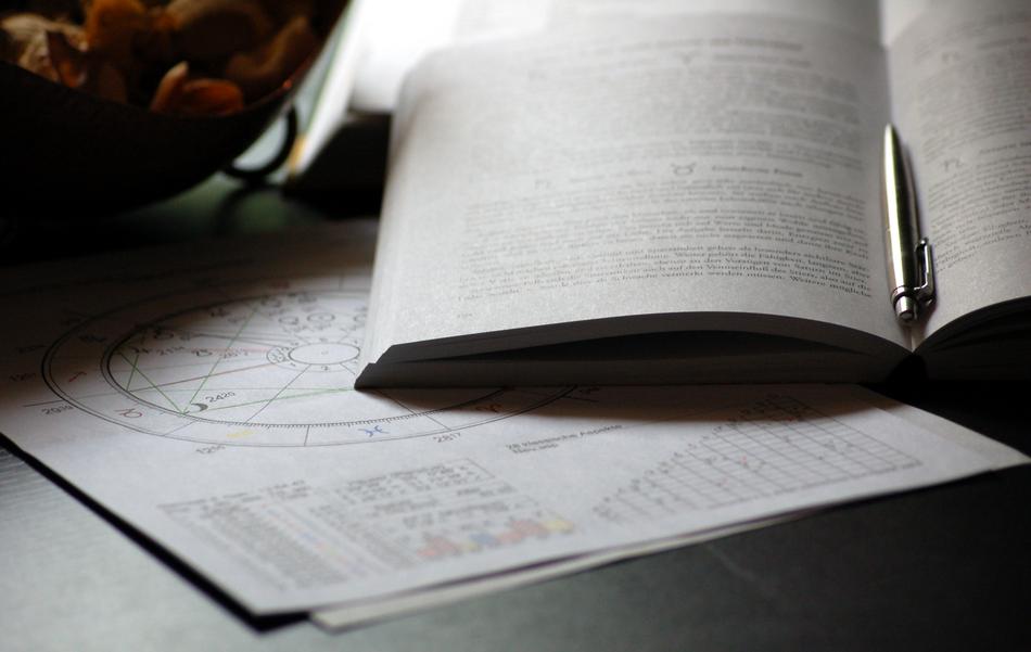 heet of paper lying under a book