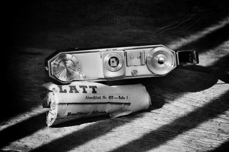 Old camera on black background