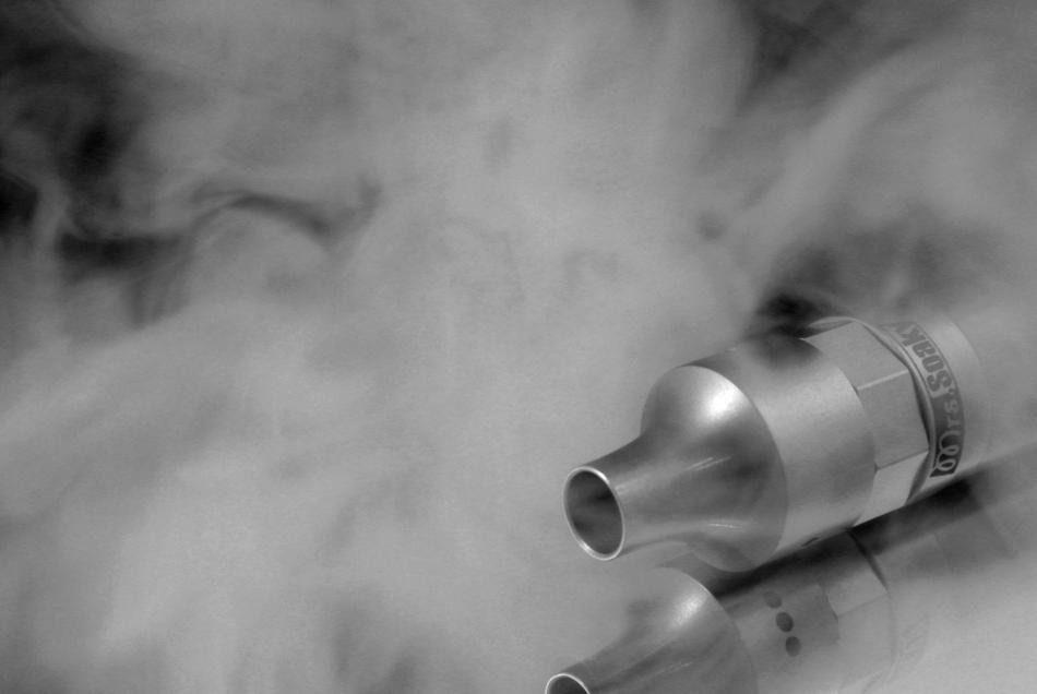 iron end of the tool shrouded in smoke