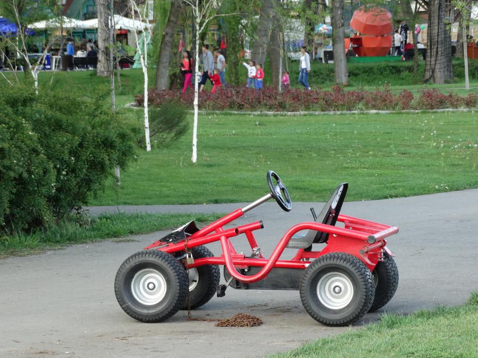 Red children car in the park