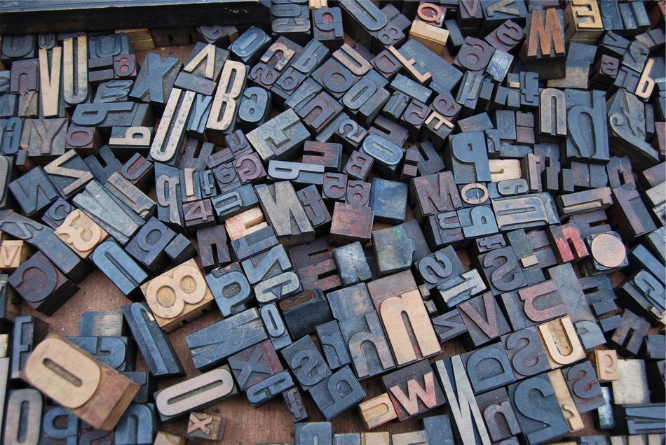Wooden cubes with letters scattered on the floor