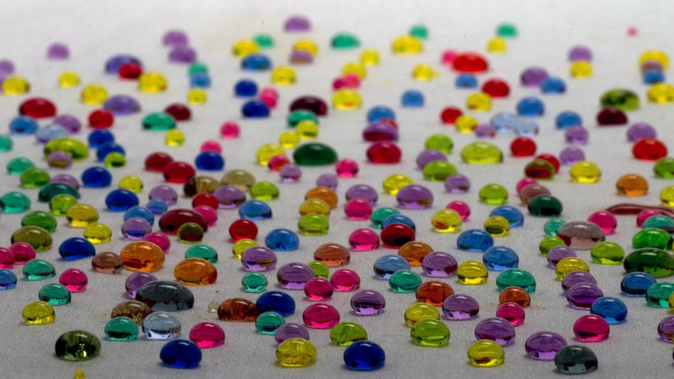 Multicolored rubber drops with water