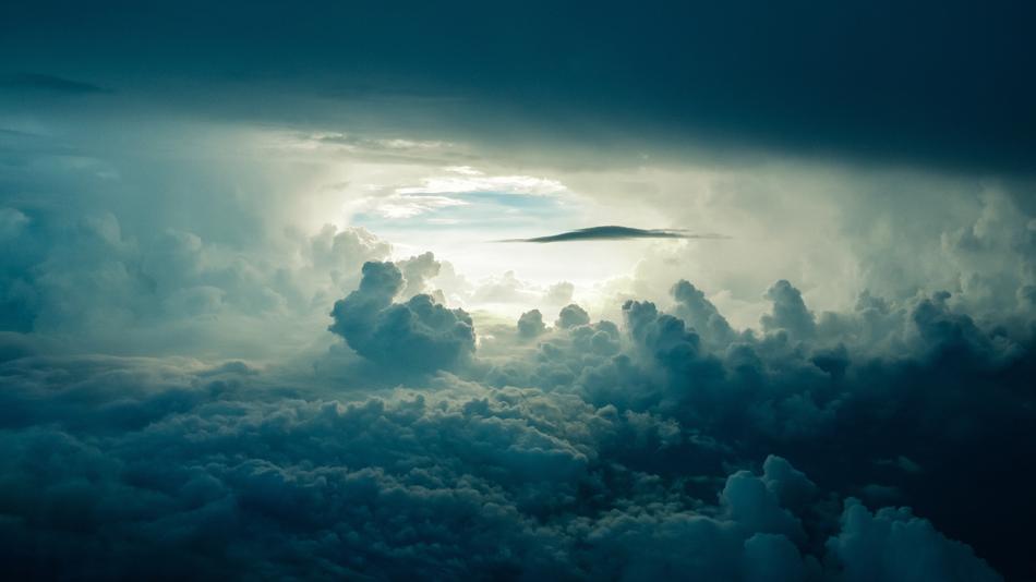sun rays and cumulus clouds