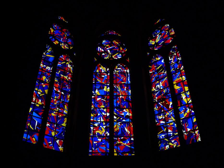multicolored stained glass windows in Reims Cathedral, France