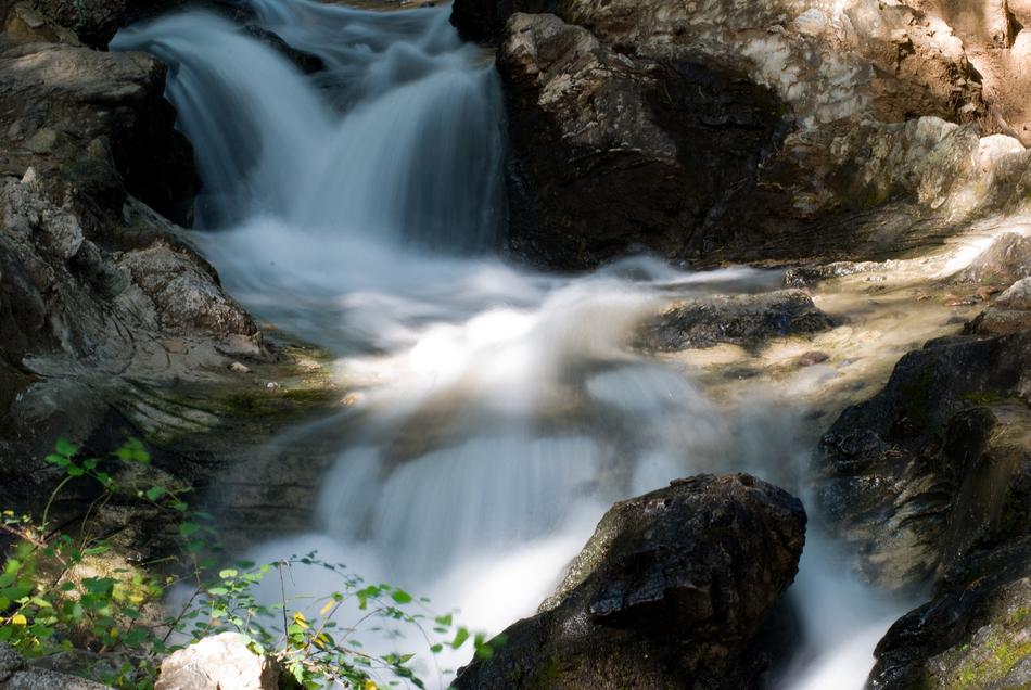 waterfall flowing down a mountain of rocks