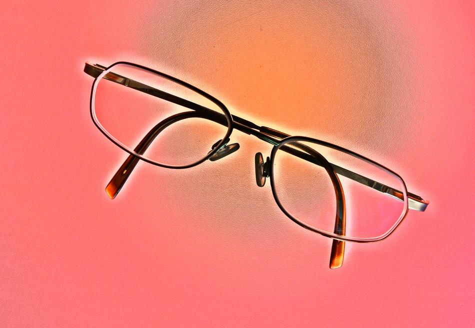 Reading Glasses at pink background