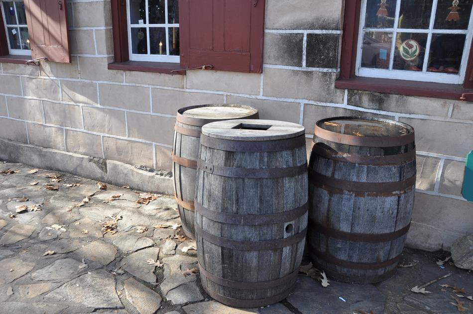 Wooden barrels standing by the house