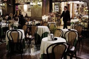 businessman enters to Restaurant hall, italy, Milan