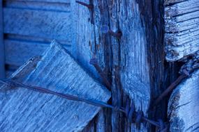 Barbed wire with nails hammered into the wood