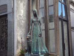 grave in the cemetery of a girl with a dog