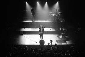 people performing on a bright stage
