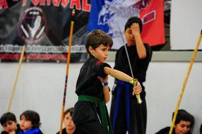 A child wields a katana