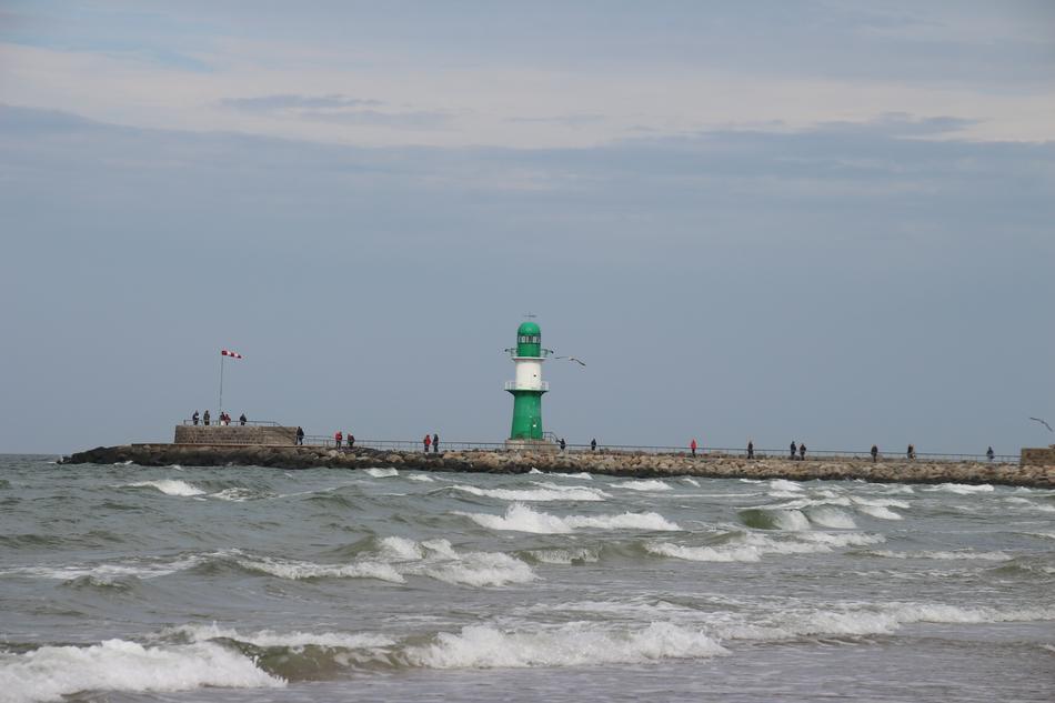 Green lighthouse near the pier