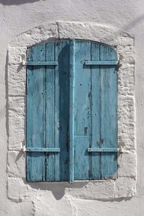 Blue Shutters at White Wall