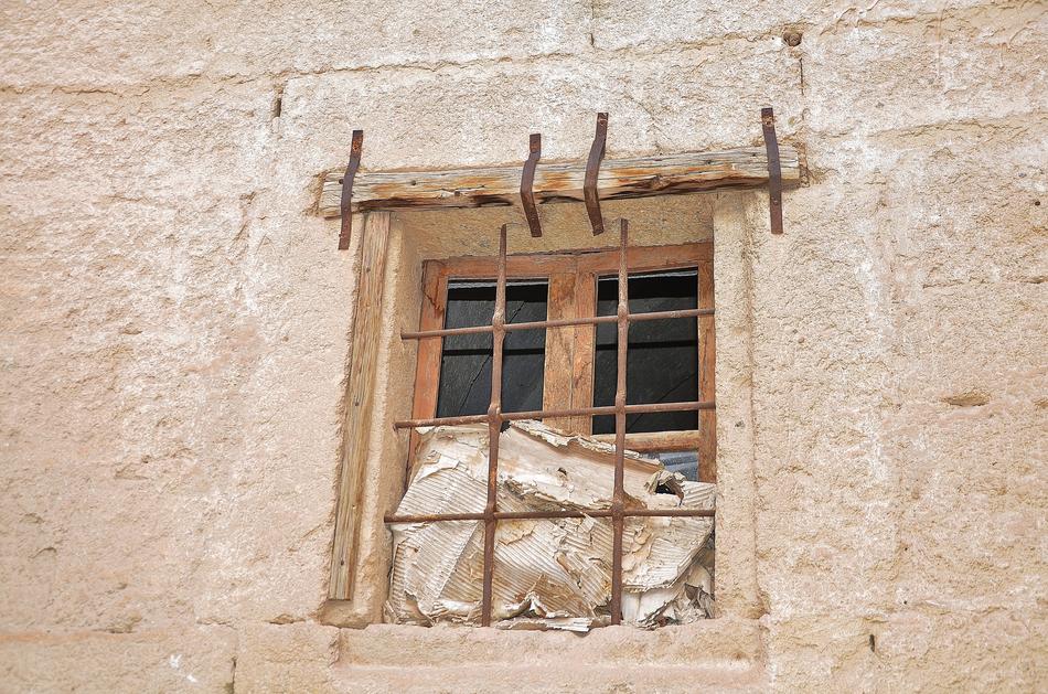 Wooden window with bars