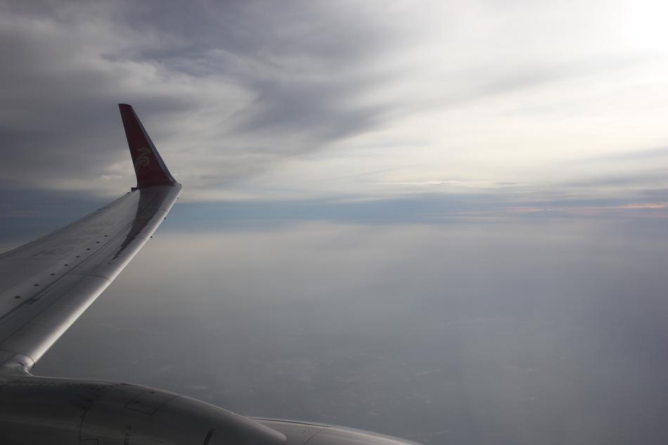 airplane wing in the evening sky