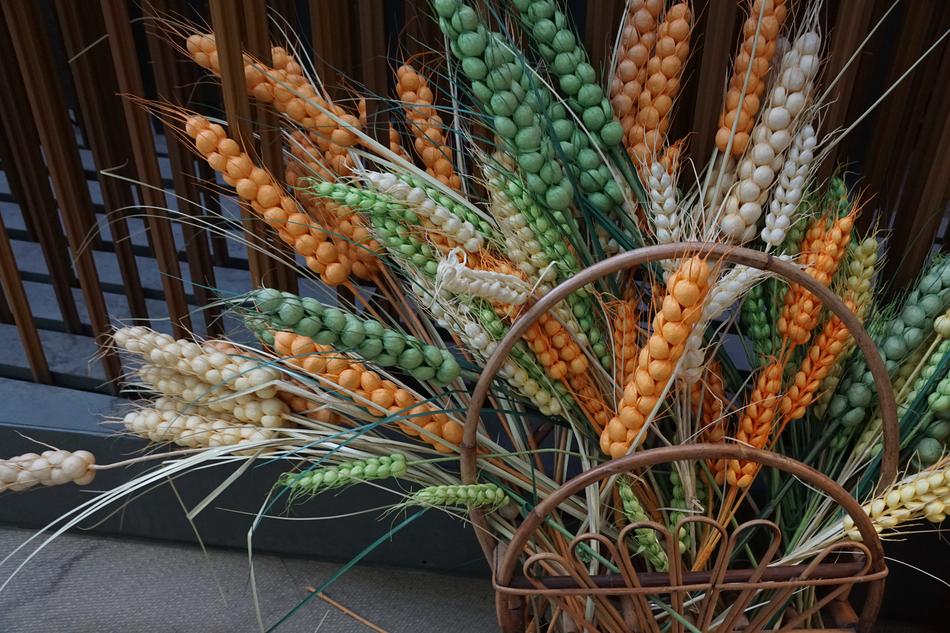Spikes of wheat in a wooden basket