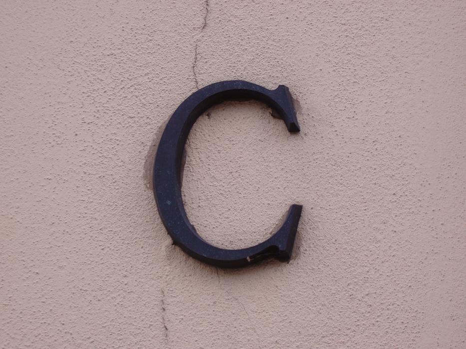 The letter C attached to the wall