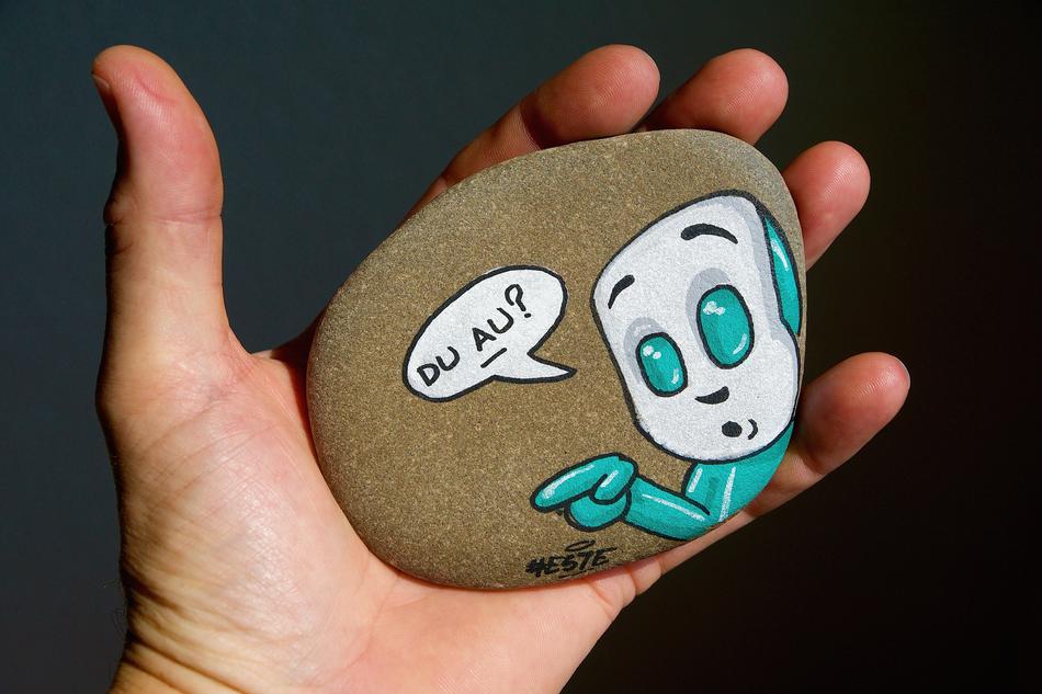 Drawing on Stone holding Hand