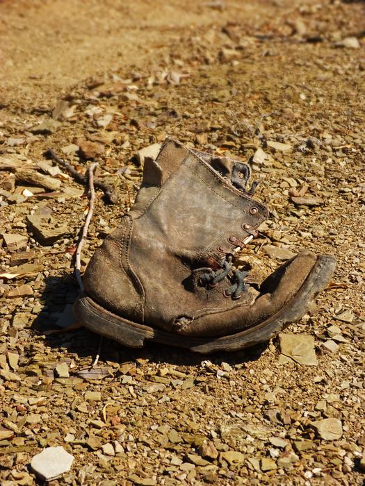 old forgotten shoe on the beach